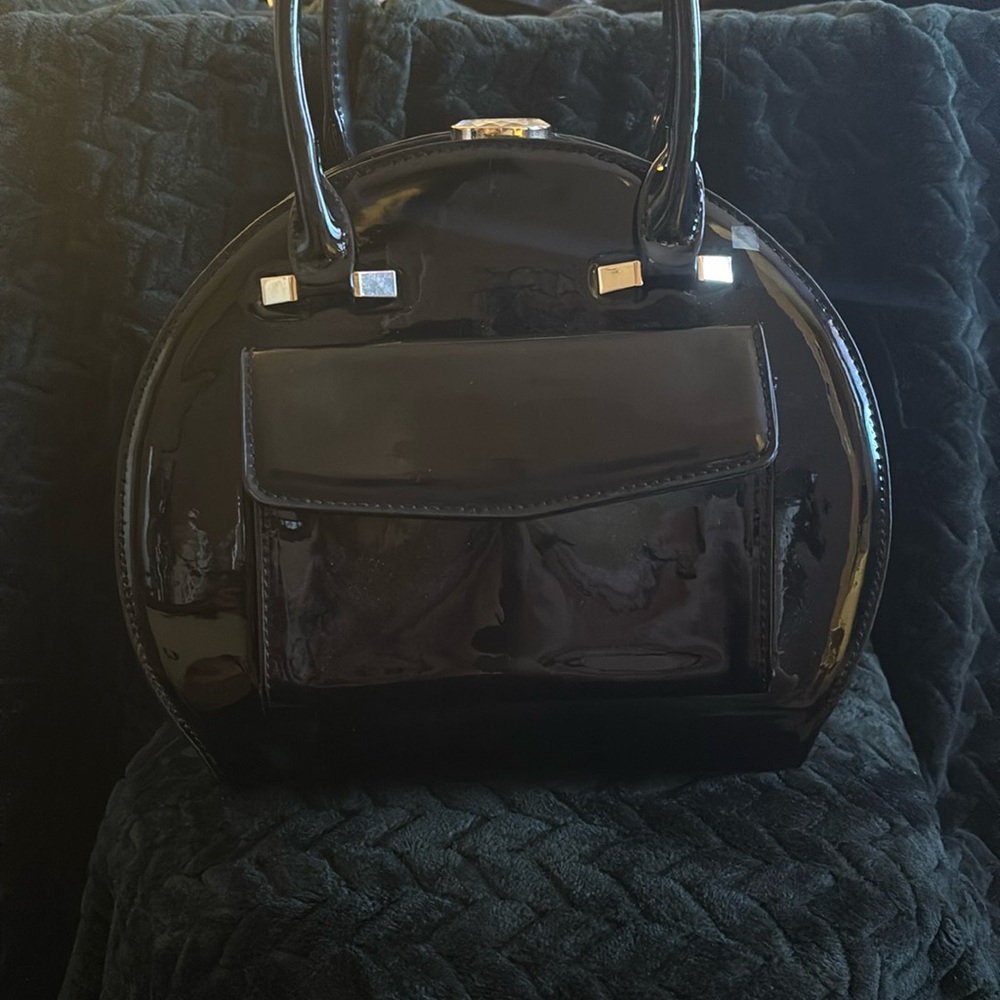 La Terre black patent goldtone trim bag with strap